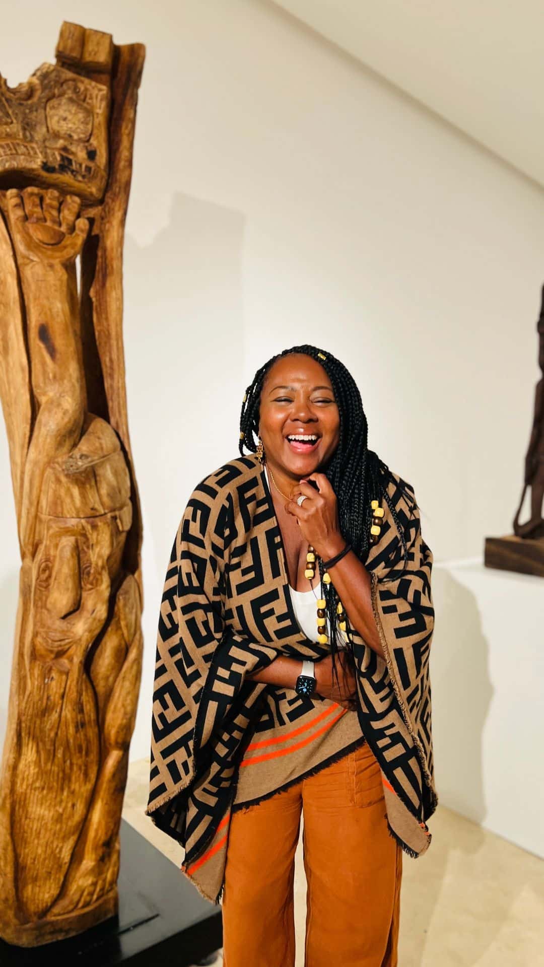 Tomiko Harvey smiling in an art gallery in Cape Town, South Africa